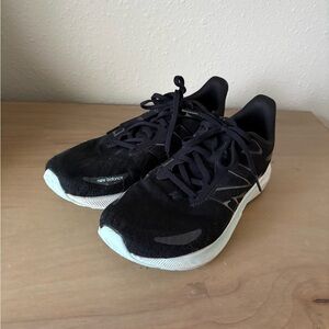 9.5 Women’s New Balance Black Sneakers with White Accents